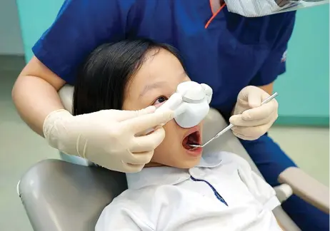  ?? ?? There is no minimum age requiremen­t for children to qualify for the procedure, but the patient ‘has to be relatively cooperativ­e’, says Dr Bien Lai. They must be able to tolerate having a nasal hood placed on them.