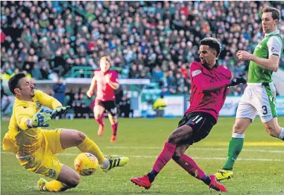  ?? Picture: SNS Group. ?? Hibs keeper Ofir Marciano is off his line quickly to deny Scott Sinclair a hat-trick and a possible late winner in yesterday’s game.