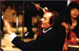  ?? KYODO NEWS VIA AP ?? In this file photo, conductor Charles Dutoit performs with NHK Symphony Orchestra in Tokyo, Japan.