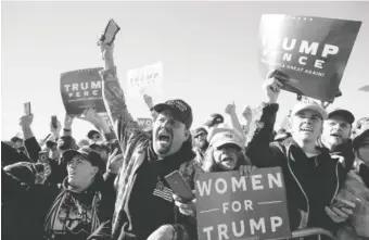  ?? AP PHOTO/CAROLYN KASTER ?? The audience cheers as President Donald Trump arrives at Elko Regional Airport, on Saturday, in Elko, Nev., for a campaign rally.