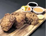  ?? Credit ?? Fried chicken is also on the J&C Oyster menu, a nod to Chef Raheem Sealey’s famous chicken at KYU in Wynwood.