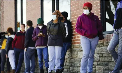  ?? Photograph: Matt Rourke/AP ?? People wait in line to receive coronaviru­s vaccines in Philadelph­ia on Monday.