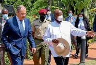  ?? AP ?? Russian Foreign Minister Sergey Lavrov, left, and Ugandan President Yowerei Museveni walk during their meeting in Entebbe.