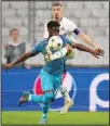  ?? ?? Tottenham’s Yves Bissouma (front), is challenged by Marseille’s Valentin Rongier during the Champions League Group D soccer match between Marseille and Tottenham Hotspur at the Stade Velodrome in Marseille, France. (AP)