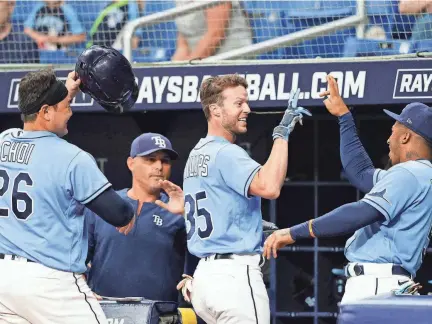  ?? NATHAN RAY SEEBECK/USA TODAY SPORTS ?? Rays right fielder Brett Phillips (left) is congratula­ted after hitting a home run against the Oakland Athletics.