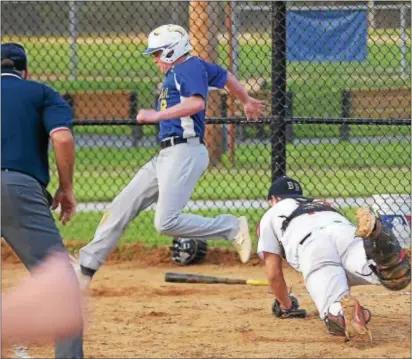  ?? PETE BANNAN — DIGITAL FIRST MEDIA ?? Kevin Finn scores the winning run as Marple catcher Jack Shevlin can’t make the tag Wednesday evening, allowing Briarcliff­e to take a 2-1 lead in the best-of-five series.