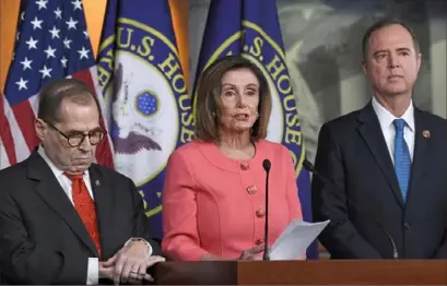  ?? Susan Walsh/Associated Press ?? House Speaker Nancy Pelosi, D-Calif., flanked by Rep. Jerrold Nadler, D-N.Y., left, and Rep. Adam Schiff, DCalif., speaks during a news conference Jan. 15 to announce impeachmen­t managers.