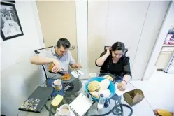  ??  ?? Juan Torres Garcia and his wife, Veronica Velasquez, eat breakfast Saturday at their Santa Fe home. The couple, like many other immigrant parents in the U.S., is scrambling to find a contingenc­y plan for their 9-year-old son in case the family becomes...