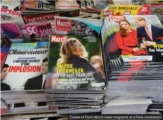  ??  ?? Copies of Paris Match news magazine at a Paris newsstand.