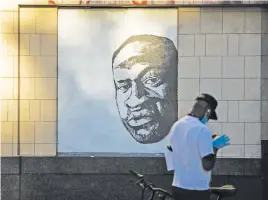  ?? Picture: AFP ?? BLACK LIVES MATTER. A mural of George Floyd is drawn in downtown Oakland, California during a ‘Sit Out the Curfew’ protest.