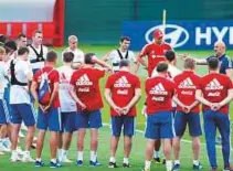  ?? AP ?? Russia’s head coach Stanislav Cherchesov speaks with his players during a training session.