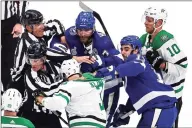  ?? Bruce Bennett / Getty Images ?? The Lightning’s Victor Hedman (77) and Cedric Paquette (13) scuffle with the Stars’ John Klingberg (3) during Game 2 of the Stanley Cup Final on Monday.