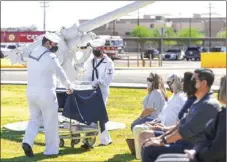  ?? PHOTO VINCENT OSUNA ?? Naval Air Facility El Centro’s birthday cake being hauled in during NAFEC’s 75th anniversar­y on Friday.