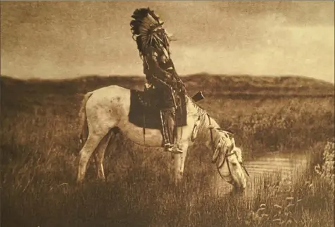  ?? Post-Gazette ?? A 40-volume set by famed photograph­er Edward S. Curtis — a landmark work documentin­g Native Americans that contained the photos “An Oasis in the Bad Lands,” above; “Medicine Man,” below second from left; and “Geronimo,” below right — was part of the theft over 25 years of rare books, plates and photos from the Carnegie Library of Pittsburgh.