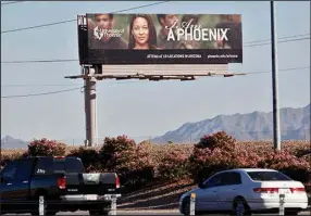  ?? (AP/Matt York) ?? A University of Phoenix billboard is shown in Chandler, Ariz., in November 2009. The for-profit college agreed to a $191 million settlement in 2019 over fraudulent claims about partnershi­ps with major companies. C.C. “Cliff” Gibson III, chairman of the UA System board of trustees until March 1, has expressed concerns about a possible affiliatio­n with Phoenix.