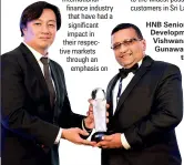  ??  ?? HNB Senior Manager - Developmen­t Banking Vishwanath Gunawarden­a accepting the award for Most Innovative Microfinan­ce Bank in
Sri Lanka at the recently concluded Internatio­nal Finance Magazine Awards (IFM) 2017 in Singapore.