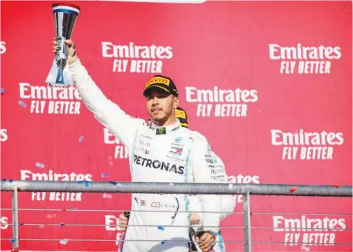  ?? Reuters ?? Lewis Hamilton celebrates after winning his sixth world championsh­ip at the United States Grand Prix on Monday.