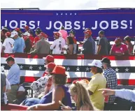  ?? BRENDAN SMIALOWSKI / AFP VIA GETTY IMAGES FILES ?? Supporters listen in August as President Donald Trump
delivers remarks in Wisconsin on the economy.