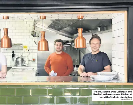  ?? Adrian White © ?? > Sam Jackson, Dino Callergari and Ben Ball in the restaurant kitchen at Inn at the Sticks in Llansteffa­n