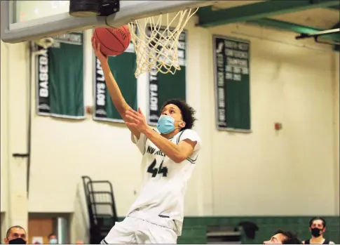  ?? Christian Abraham / Hearst Connecticu­t Media ?? New Milford’s Jojo Wallace, son of former Knick John Wallace, hits a layup against Joel Barlow in New Milford on Feb. 13.