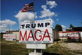  ?? Photograph: Brian Snyder/Reuters ?? Handmade signs supporting Donald Trump stand outside a business in Manitowoc, Wisconsin, on 18 August.