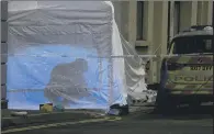  ?? PICTURE: SWNS.COM/PAUL DAVEY. ?? KNIFE EPIDEMIC: A white police tent covers the scene of a stabbing death in Hackney yesterday.