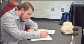  ??  ?? Mason Watson signed an agreement to head to the Freed-Hardeman University Lions baseball team when he graduates from Rockmart.