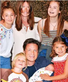  ??  ?? Family man: Jamie Oliver, with wife Jools and children, aged one to 16, has not ruled out having another child