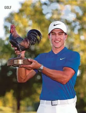  ?? AFP PIC ?? Cameron Champ with the trophy after winning the Sanderson Farms Championsh­ip on Sunday.