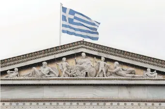  ?? PETROS GIANNAKOUR­IS/The Associated Press ?? Greece and its creditors are extending talks over the weekend in the hopes of reaching a deal on future
financing for the debt-laden nation. Creditors are concerned about giving in to Greece’s demands.