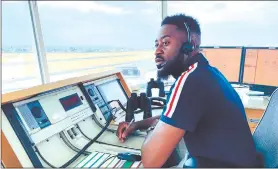  ?? Photo: Contribute­d. ?? Attentive and focused… Hamutenya Hidipo Katewa on duty at the Eros Airport in Windhoek, overseeing the in and outflow of aircraft.