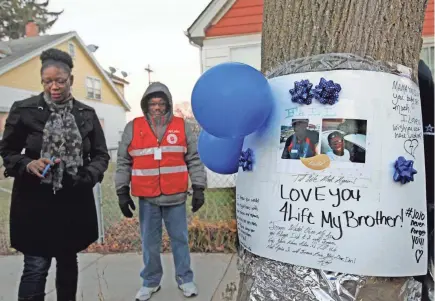  ?? ANGELA PETERSON/MILWAUKEE JOURNAL SENTINEL ?? Brenda Hines prepares for a vigil to remember her son, Donovan Hines, near West Hampton Avenue and North 29th Street where he was fatally shot in 2017.