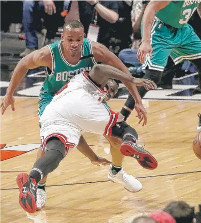  ?? | AP ?? The Bulls’ Jerian Grant takes a tumble and loses the ball out of bounds while being defended by the Celtics’ Avery Bradley.