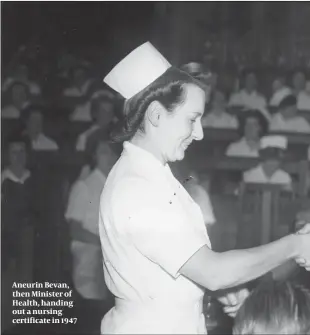  ??  ?? Aneurin Bevan, then Minister of Health, handing out a nursing certificat­e in 1947