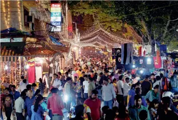  ?? — PTI ?? A crowd of shoppers at New Delhi’s Sarojni Nagar Market on the evening before Diwali on Wednesday.