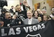  ?? John Locher Associated Press ?? OWNER MARK DAVIS, center, says the Raiders are serious about exploring a move to Las Vegas.
