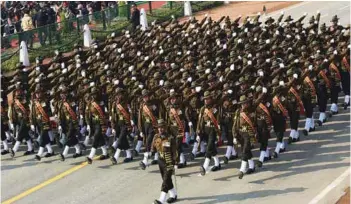  ??  ?? (Top) The Sikh Light Infantry Regiment Marching Contingent (Above) The Kumaon Regiment