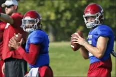  ?? SUE OGROCKI — THE ASSOCIATED PRESS FILE ?? In this Monday file photo, Oklahoma quarterbac­ks Jalen Hurts, left, and Tanner Mordecai, right, throw during NCAA college football practice in Norman, Okla. Hurts is competing with Mordecai, a redshirt freshman, and Spencer Rattler, a true freshman, to become starting quarterbac­k.