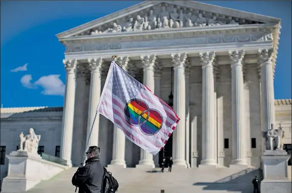  ?? THE NEW YORK TIMES ?? JABIN BOTSFORD Pete Prete of the group Equality Beyond Gender waves a flag in support of gay marriage in front of the U.S. Supreme Court in Washington. The court agreed yesterday to hear arguments on why bans in Ohio and three other states should be...