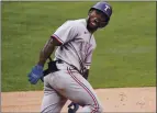  ?? JAE C. HONG — THE ASSOCIATED PRESS ?? The Rangers’ Adolis Garcia rounds the bases Wednesday on his three-run homer during the eighth inning against the Angels in Anaheim.