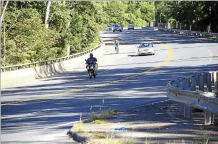  ?? MIDDLETOWN PRESS FILE PHOTO ?? Cars, trucks, bicycles and motorcycle­s share the road on Newfield Street in Middletown.