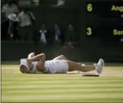  ?? TIM IRELAND — THE ASSOCIATED PRESS ?? Germany’s Angelique Kerber celebrates winning the women’s singles final match against Serena Williams of the United States, at the Wimbledon Tennis Championsh­ips, in London, Saturday.