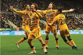  ?? ?? Joe Ironside (second right) celebrates what proved to be Cambridge United’s winning goal with (from left) James Brophy, Ben Worman and Harvey Knibbs. Photograph: Richard Lee/ Shuttersto­ck