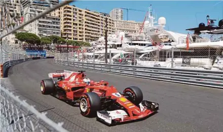  ?? AP PIC ?? Ferrari’s Sebastian Vettel steers his car during the Monaco Grand Prix at the Monte Carlo
circuit yesterday.