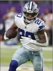  ?? (AP/Bruce Kluckhohn) ?? Dallas running back Tony Pollard had two touchdown catches in the Cowboys’ 40-3 rout of the Minnesota Vikings on Sunday at U.S. Bank Stadium in Minneapoli­s. Pollard finished with a career-high 189 yards from scrimmage.