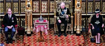  ?? Ben Stansall/WPA Pool/Getty Images ?? ● From left: Prince William, Prince Charles, and Camilla, Duchess of Cornwall sit by the The Imperial State Crown, during the State Opening of Parliament