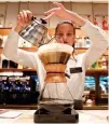  ?? REUTERS ?? AN EMPLOYEE prepares a coffee inside the new Starbucks Reserve Roastery flagship in downtown Milan, Italy, Sept. 4.