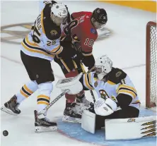  ?? AP PHOTO ?? GROWING UP: Bruins defenseman Brandon Carlo (25), who has a plus-3 rating this season, is developing chemistry with his new partner, John Moore.