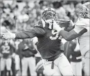  ?? Wally Skalij Los Angeles Times ?? RAMS DEFENSIVE LINEMAN Dominique Easley, left, is shown in action last season against the 49ers.