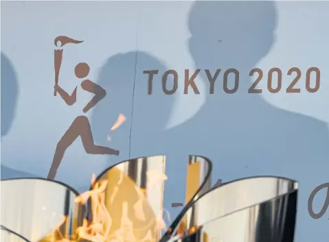  ?? AFP ?? The logo for the Tokyo 2020 torch relay is pictured as the Olympic flame goes on display at the Aquamarine Fukushima aquarium in Iwaki in Fukushima prefecture.